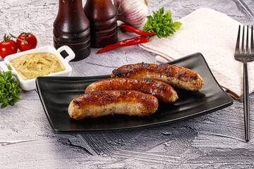 Delicous natural roasted sausages in the plate