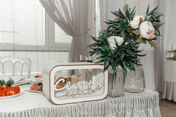 The wedding table. The family table. Flowers.