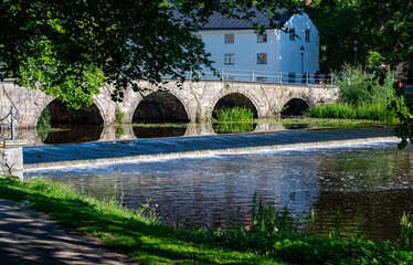 Obraz premium Old arch bridge made of stones in Orebro city center Sweden