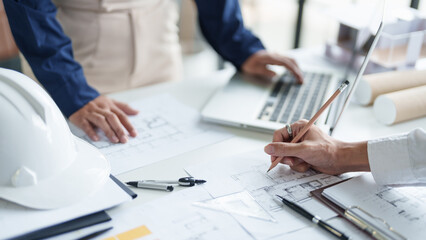 Architecture drawing on architectural project business architecture building construction Colleagues designer Planning Design on blueprint and compasses