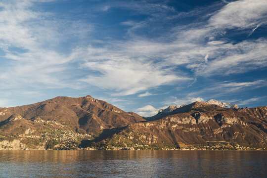 Mountain range with dramatic blue sky and white clouds