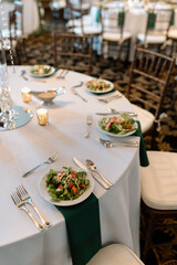 salads and table settings at dinner party reception event