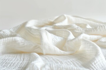 A close-up of soft, white fabric with gentle folds and texture, evoking a sense of comfort and tranquility in a minimalist style.