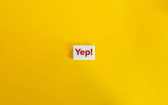 Yep! Positive Response in an informal and colloquial way. Concept of Agreement, Affirmation, or Confirmation. Red Text on Block Letter Tile on Yellow Background. 