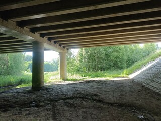 Bridge. Concrete bridge. Sunny day. Countryside. Field and trees.	