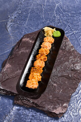 Delicious Spicy Baked Sushi Set on Black Stone Plate