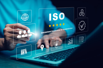 Quality assurance of business services, Businessman Hand shows the sign of the top service Quality assurance in Black background , Guarantee, Standards, ISO certification and standardization concept.