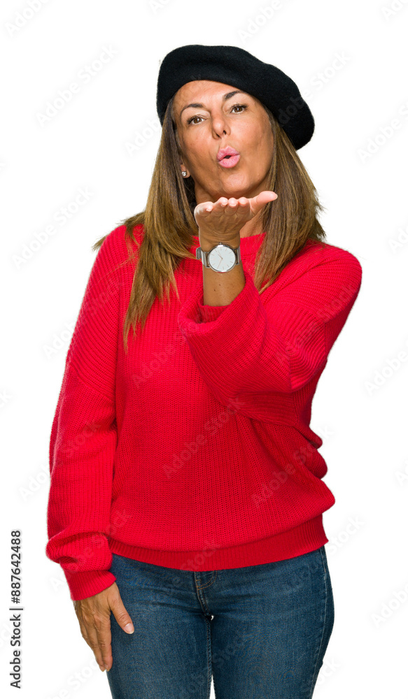 Wall mural middle age adult woman wearing fashion beret over isolated background looking at the camera blowing 