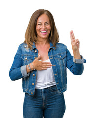 Beautiful middle age woman wearing casual denim jacket over isolated background Swearing with hand...
