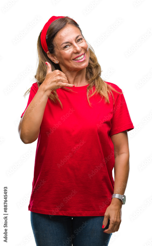 Wall mural middle age senior hispanic woman over isolated background smiling doing phone gesture with hand and 