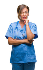 Middle age senior nurse doctor woman over isolated background thinking looking tired and bored with depression problems with crossed arms.