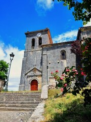 Church of Santa Marina, medieval building from Castilla with decorative flowers in a sunny day of summer