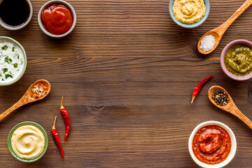 Bowls with various sauces and chili pepper with spices. Food background