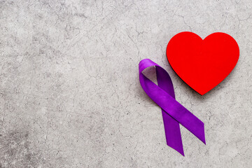 Purple ribbon with heart for world pancreas cancer day. Mental health Day