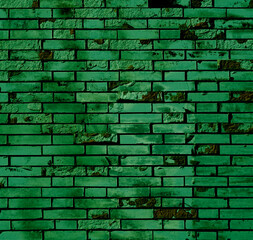 Grüne verwitterte Steinwand als rustikale Hintergrund Textur