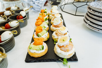 A selection of various food items is presented on the table, featuring a diverse array of dishes and ingredients. The table exhibits a broad range of options for a delicious meal