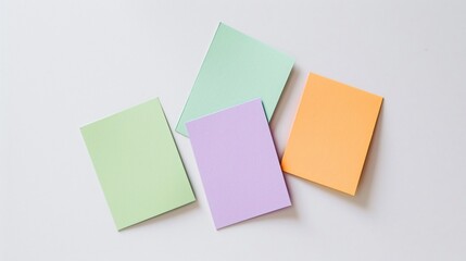 Minimalist flashcards in various colors, arranged neatly on a white surface