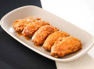 Jinsha Chicken Wings served in dish isolated on background side view of hong kong food