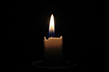 candle light on a black background, close-up of photo