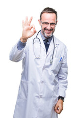 Middle age senior hoary doctor man wearing medical uniform isolated background smiling positive doing ok sign with hand and fingers. Successful expression.