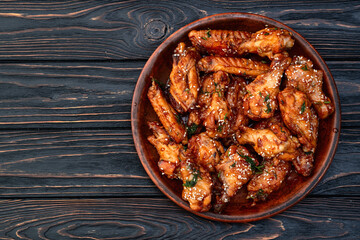 Caramelized in sause chicken wings  . Bar-b-q food background photo