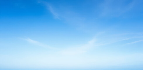 Blue Sky, Soft Clouds, Gentle Gradient, Peaceful Daylight, Calm Weather, Background, Clear Atmosphere, Subtle Whispy Formations, Tranquil Nature, Scenic Open Airspace