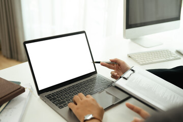Close up of businesswoman hands typing on laptop checking email or searching information