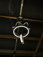 Modern Circular LED Pendant Light Hanging in a Dark Room