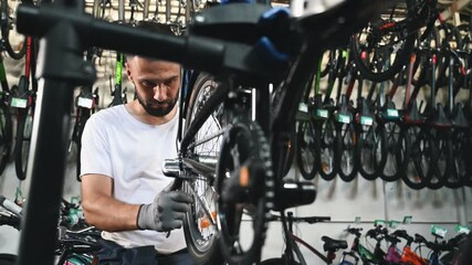 Bunch of tools. Repair man in bicycle shop, working in store.