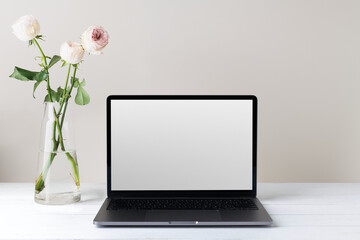 Fototapeta premium Transparent png, laptop screen mockup, minimal workspace, white flower decoration