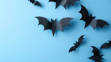 Fototapeta premium Scary Halloween decor Black paper bats over blue backdrop