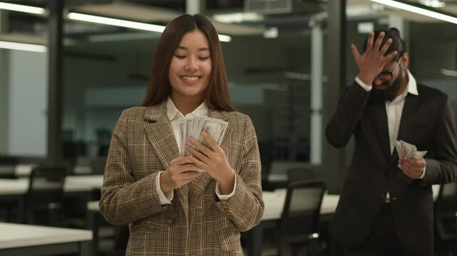 Asian happy smiling rich business girl Chinese woman Korean businesswoman big money financial success Japanese female office sad failure businessman man male guy counting little finance unequal salary