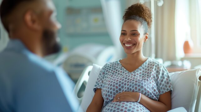 Pregnant woman with husband in a hospital room waiting for labor and delivery