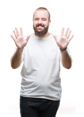 Young caucasian hipster man wearing casual t-shirt over isolated background showing and pointing up with fingers number ten while smiling confident and happy.