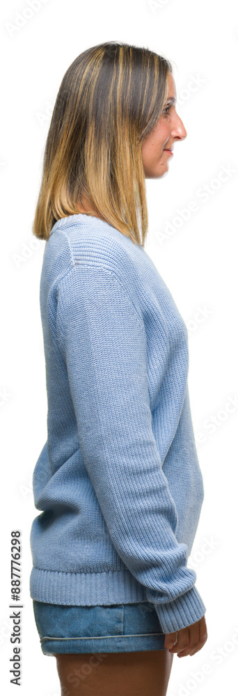 Poster Young beautiful woman wearing winter sweater over isolated background looking to side, relax profile pose with natural face with confident smile.