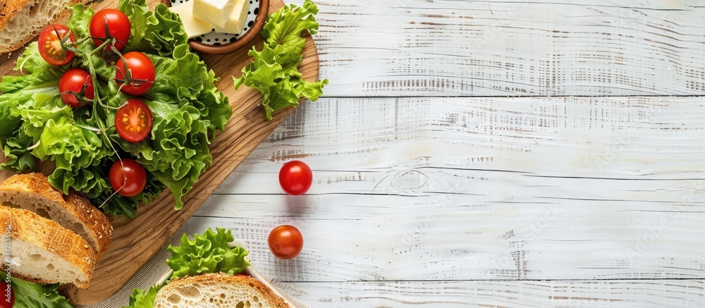 Poster a fresh ripe brunch with cherry tomatoes on a cutting board accompanied by green lettuce bread and b