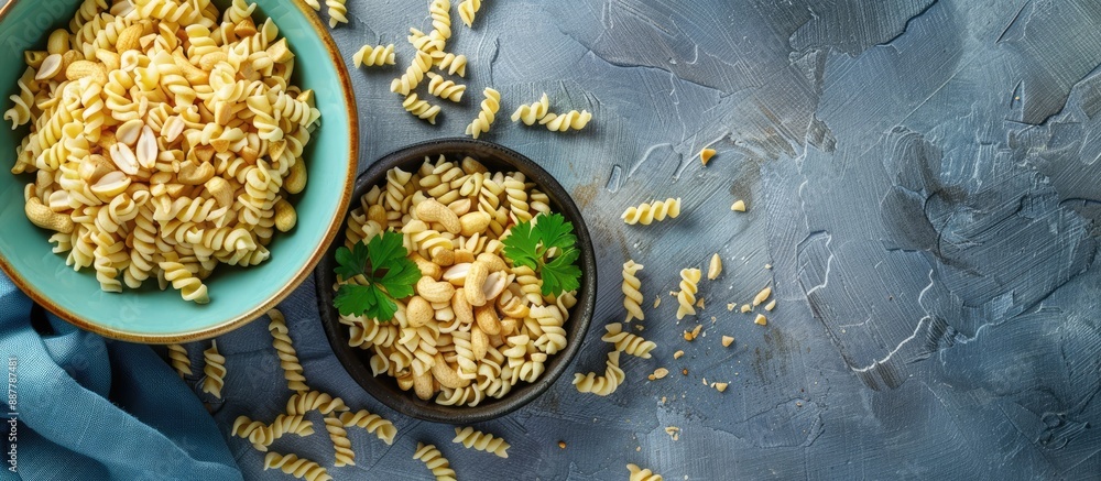 Poster top view of a small bowl filled with creamy peanut pasta placed on a table background with copy spac
