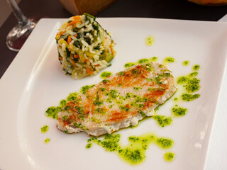 Image of tasty grilled tuna with garlic and parsley, served with rice