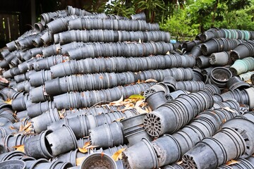 Pile of old plastic plant pots