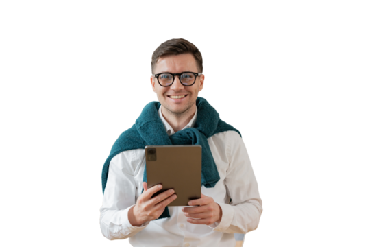 A male programmer digital nomad uses an online tablet to work in an office workplace. Cut out