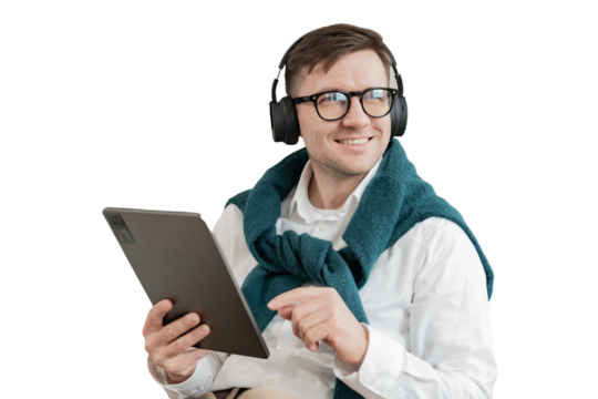 A male freelancer uses a tablet and headphones, listens to a player list in an application with music. Cut out