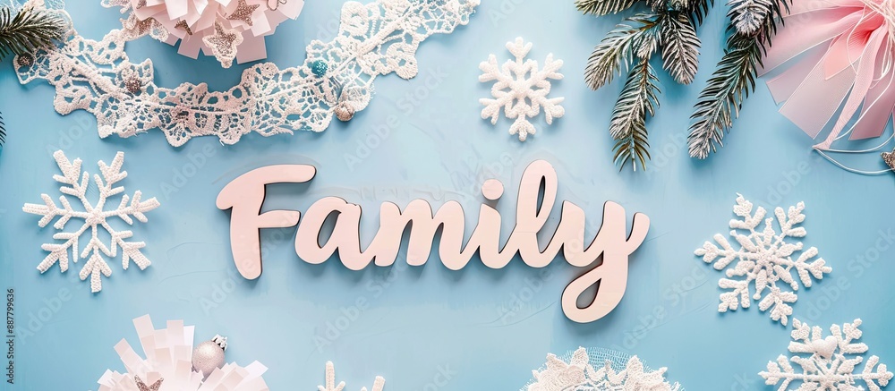 Poster Minimalistic geometric pattern on a light pink blue background adorned with lace wooden Family letters ideal as a template for a holiday card Top view with designated copy space image