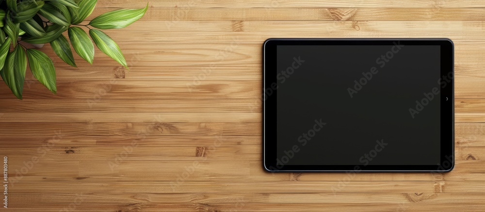 Poster tablet mockup displayed on a wooden surface with a clean slate screen ready for your content featuri