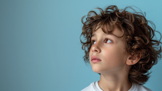 A confident Gen Alpha boy about 9 years old with curly brown hair