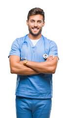 Young handsome doctor nurse man over isolated background happy face smiling with crossed arms...