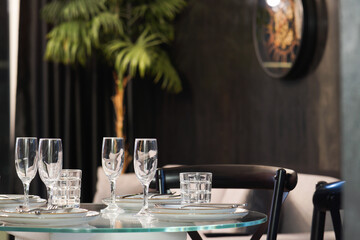 Glass table Dining table setting in a luxury apartment hotel room close up 