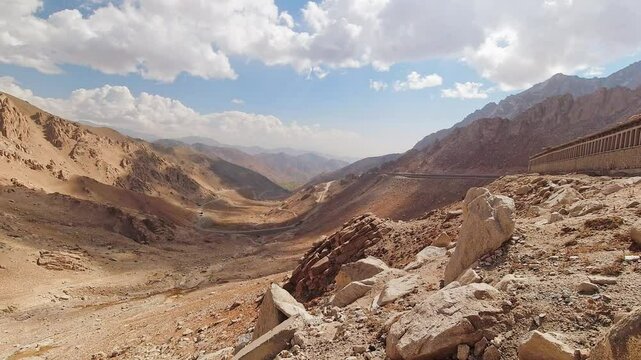 The Salang Pass. Primary mountain pass connecting northern Afghanistan with Parwan Province. Zoom in time lapse Afghnaistan mountains landscape panorama in sunny day
