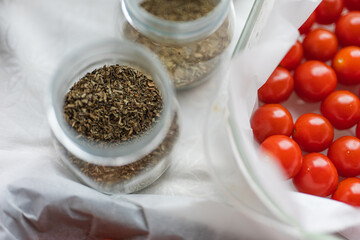 Roasted Tomatoes in Olive Oil,dry small tomatoes,cooking process,canned food,healthy home cooking,italian,spice,small tomato in an oven,colorful food,zen eating,diet