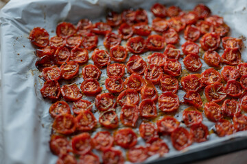 Roasted Tomatoes in Olive Oil,dry small tomatoes,cooking process,canned food,healthy home cooking,italian,spice,small tomato in an oven,colorful food,zen eating,diet