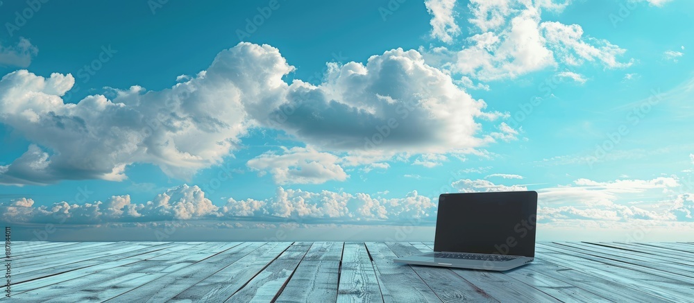 Poster laptop positioned on a wooden floor with a scenic sky as the backdrop creating a serene copy space i